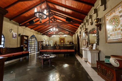 
a very large room with a large window at Pousada Camelot Inn in Alto Paraíso de Goiás
