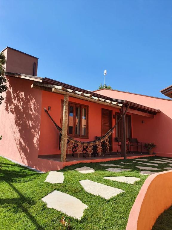 
a patio area with a patio table and chairs at Pousada Camarás in Alto Paraíso de Goiás
