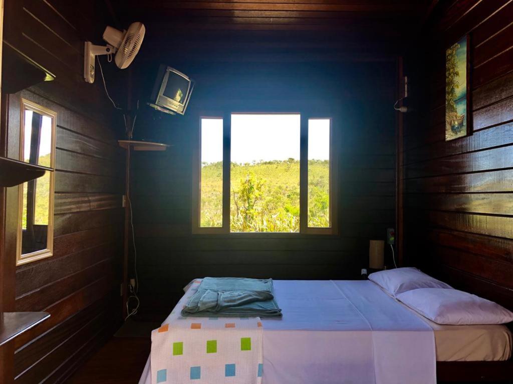 
A bed or beds in a room at Pousada Arara Canindé
